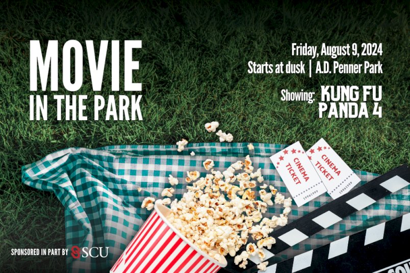 Poster-style graphic promoting the City of Steinbach's Movie in the Park; background is of a picnic blanket, popcorn, cinema tickets and a clapboard splayed out on the grass. White text has been added throughout that reads, 